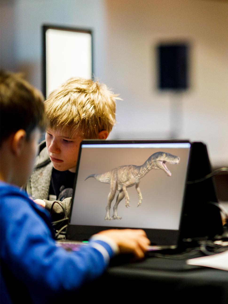Image of a child working on a laptop