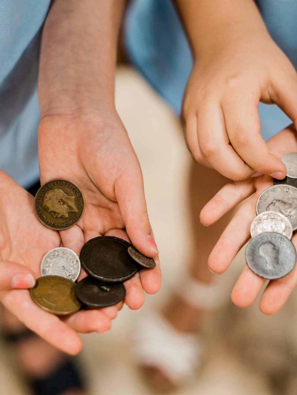 children holding coins