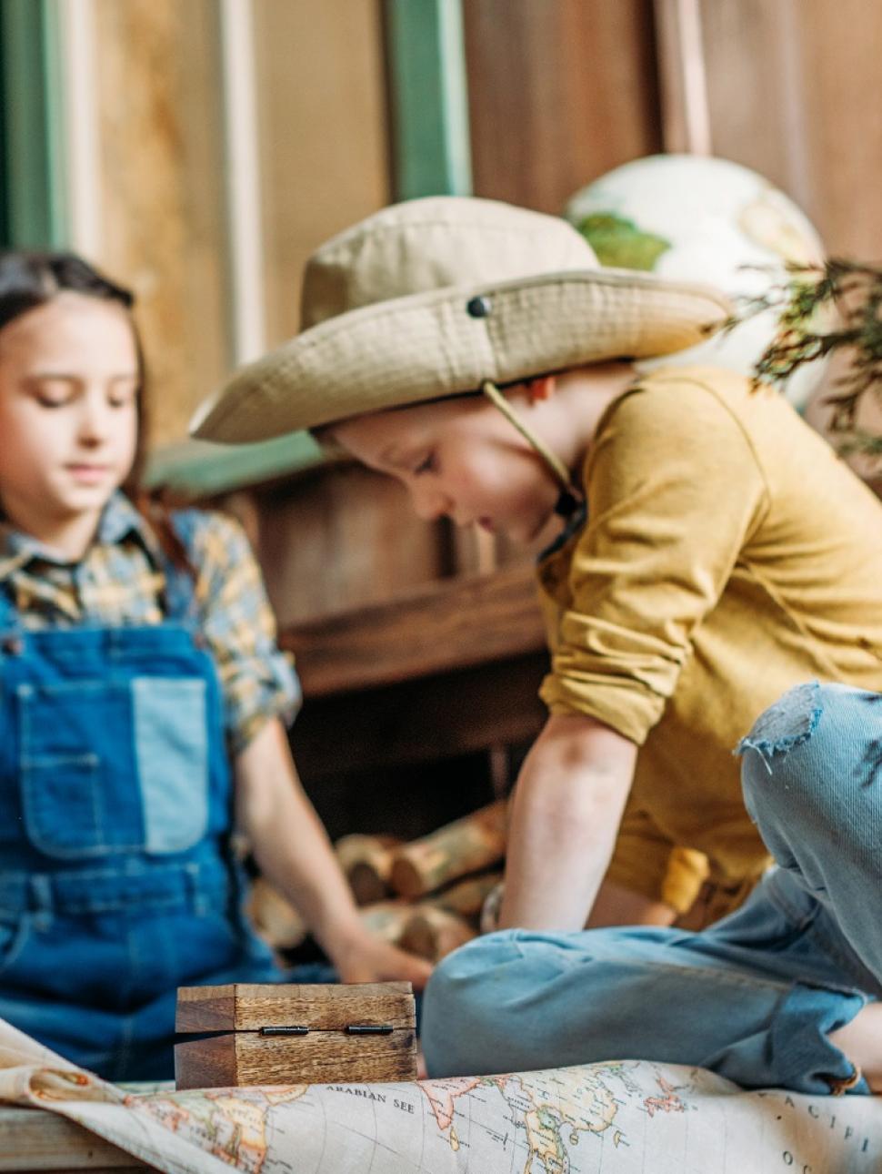 Children look at a map and explore