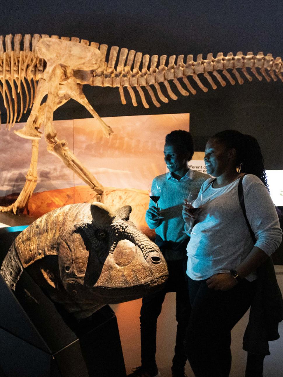 Image of to patrons exploring the Dinosaurs of Patagonia exhibition