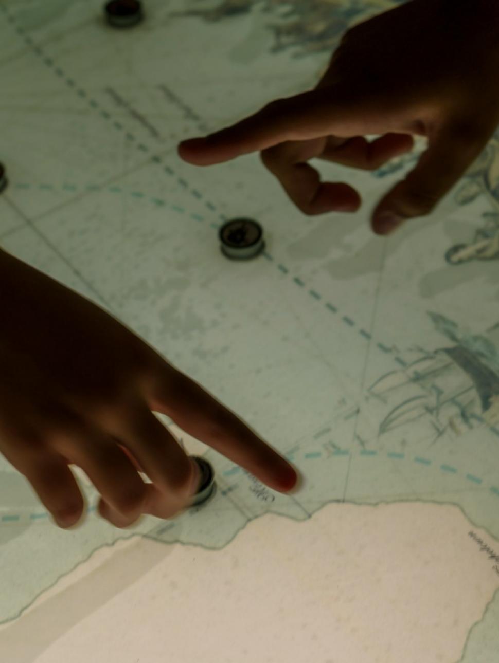 Image of kids interacting with a digital screen map