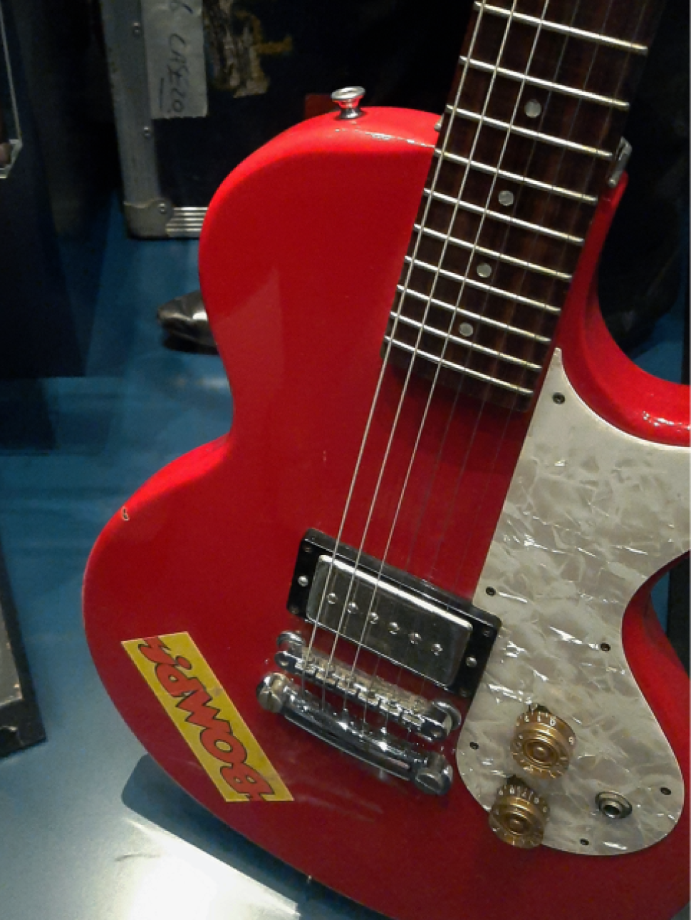 red guitar pictured in reflections gallery