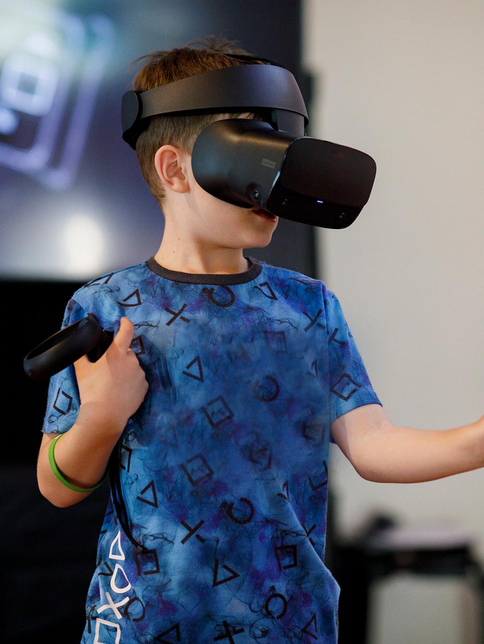 A child wearing a VR headset