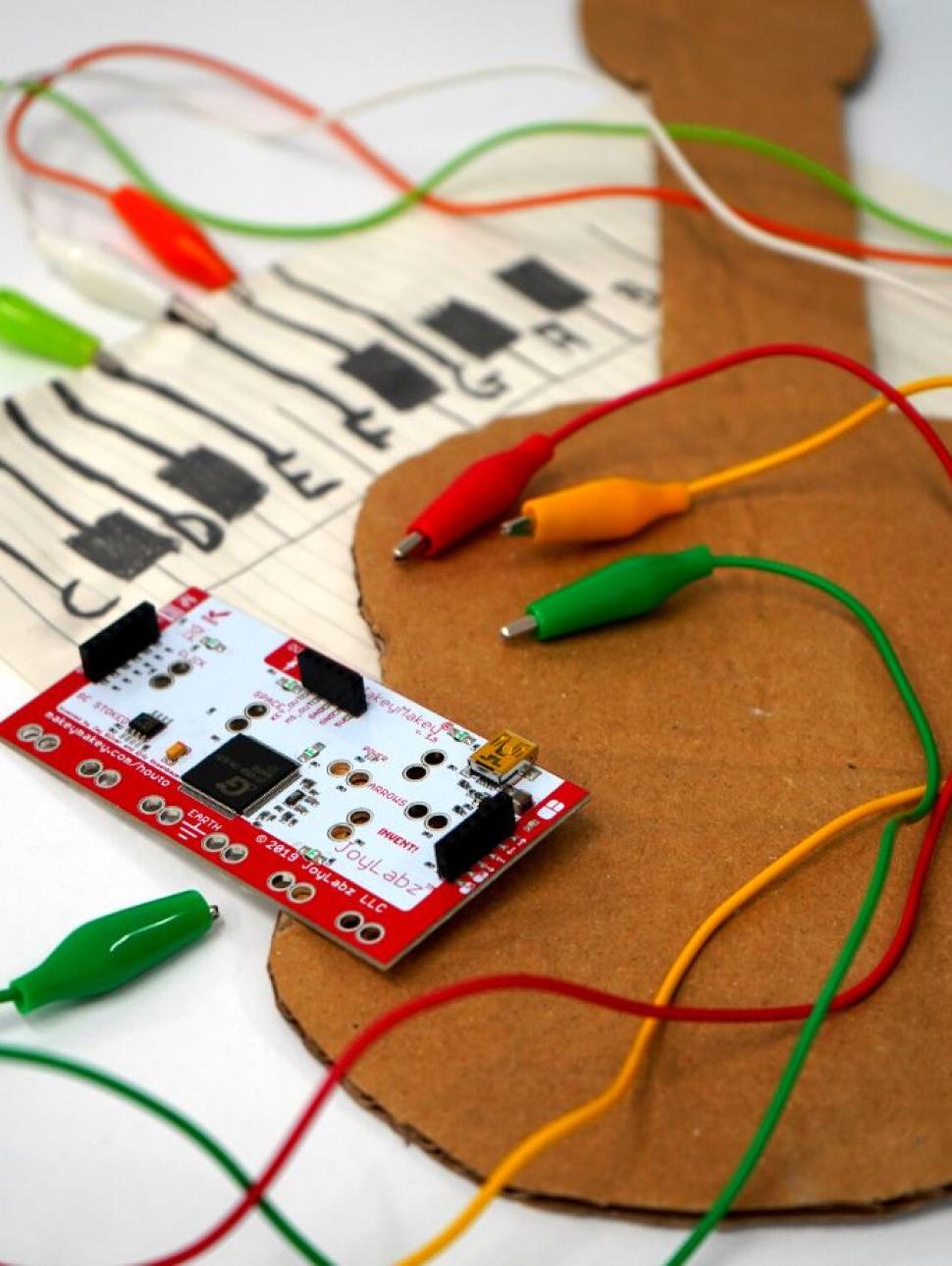 Image of cardboard guitar and wires 