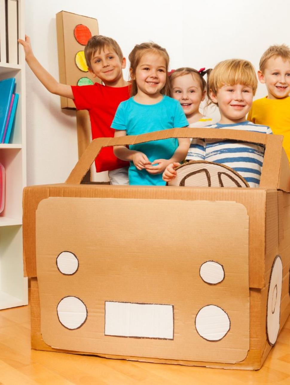 little kids smile so happy driving car creative by cardboard