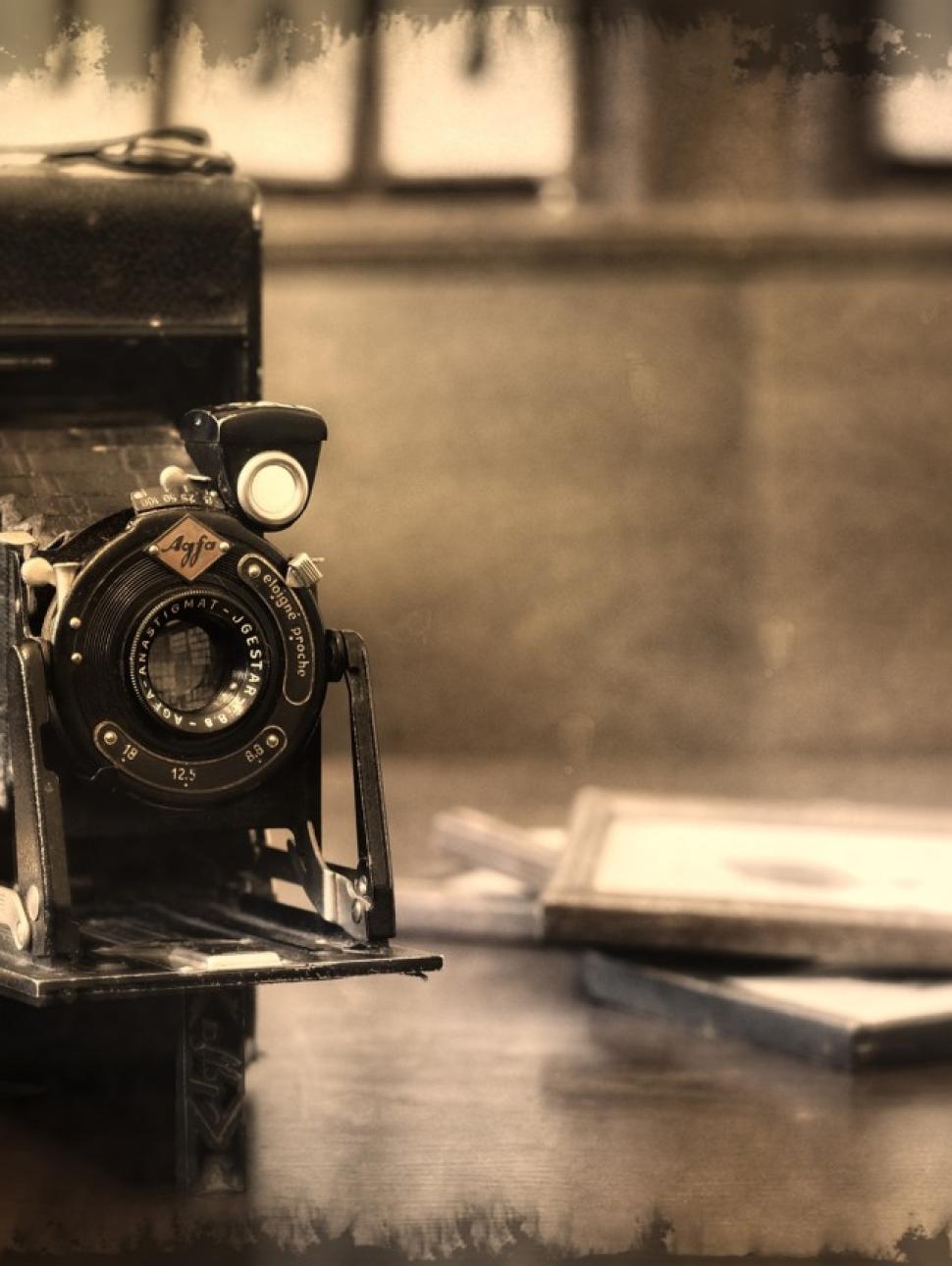 Image of an old fashioned camera shown in black and white.