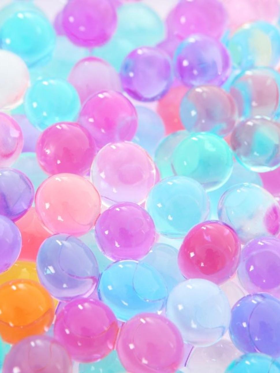 Image of colourful water beads close up.