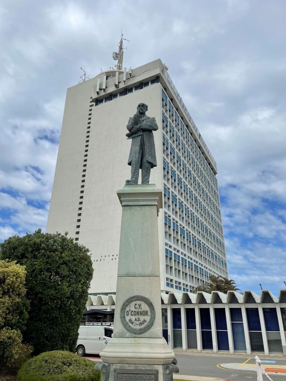 Image of the Fremantle Ports building with the statue of CY O'Connor in front of it.