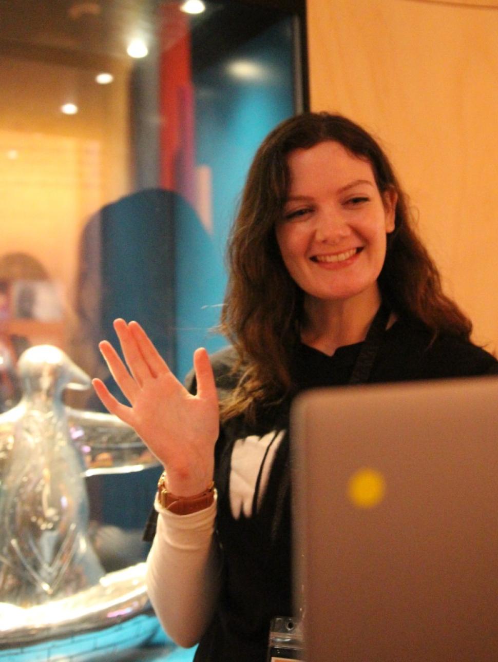 presenter with laptop in gallery