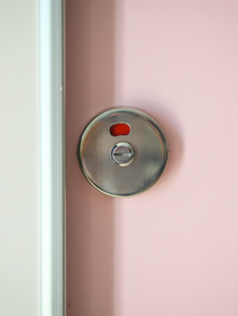 Indicator of toilet door as people is using the facilities.