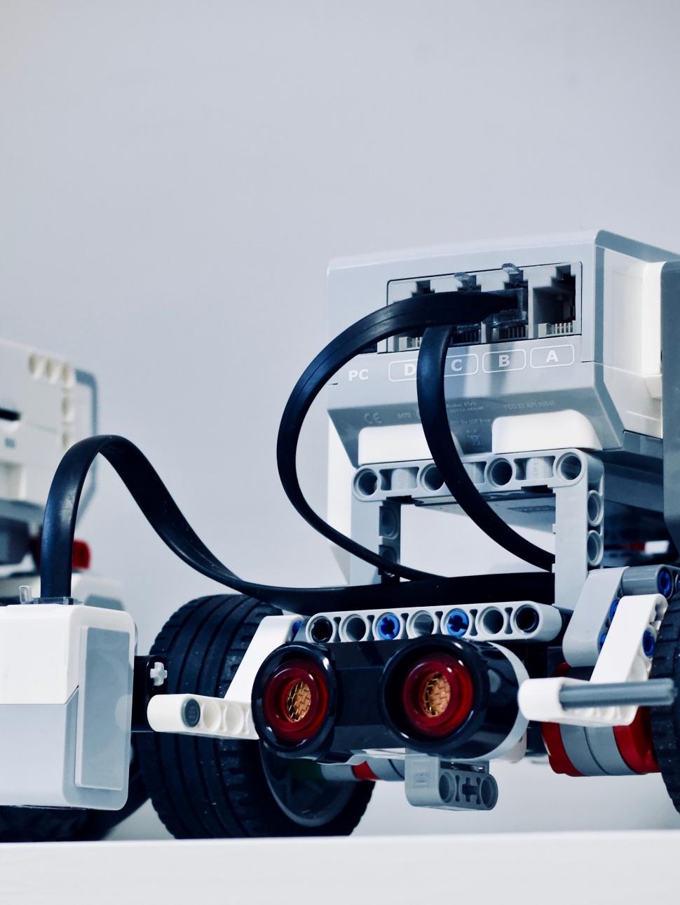 Image show a close up of two Lego Mindstorm robots