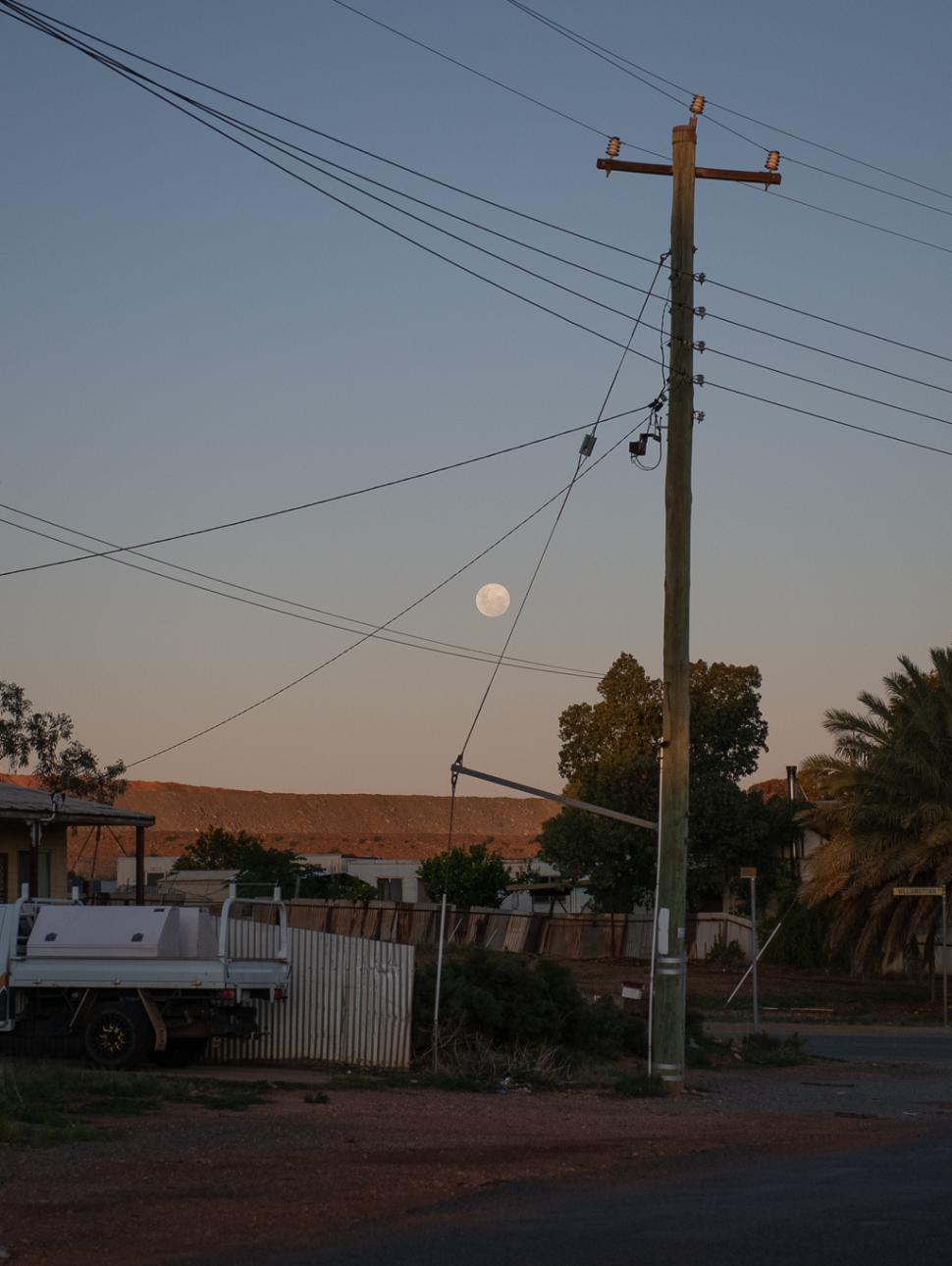 Image of a street with hold houses at sunsest