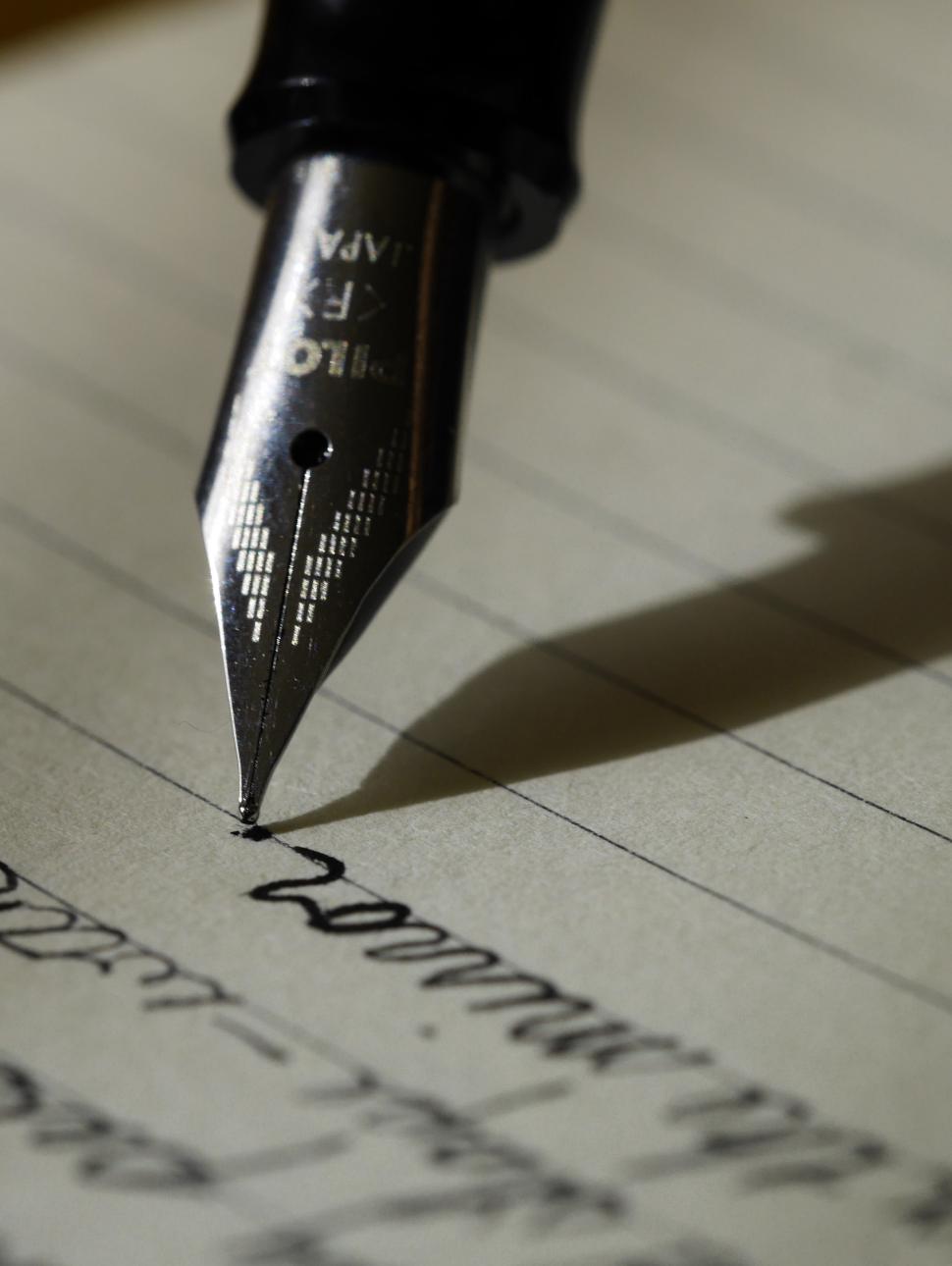Paper and pen writing 