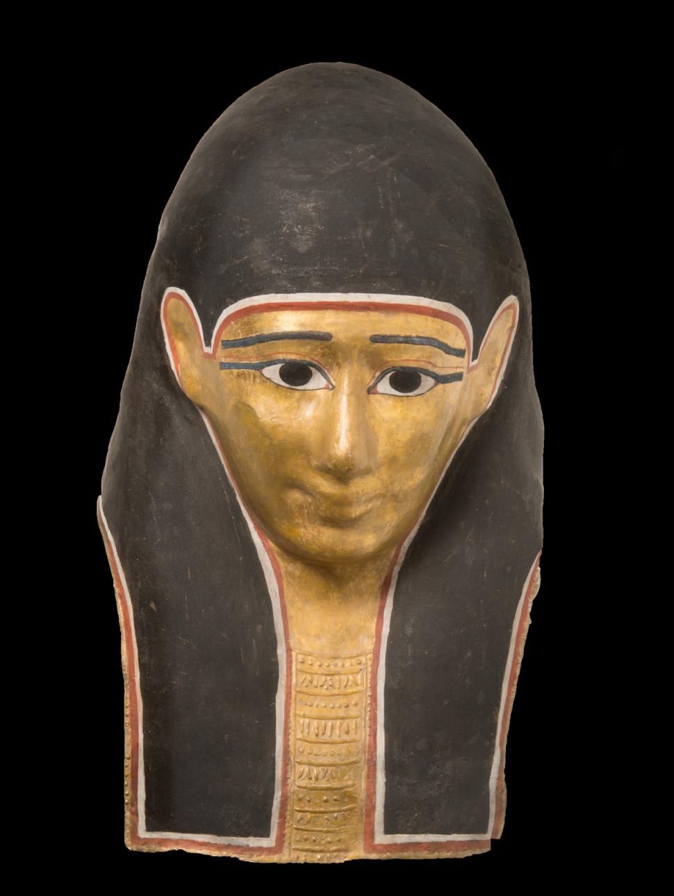 Ancient Egyptian artefact mask depicting lifelike features. golden face and black hair/headress