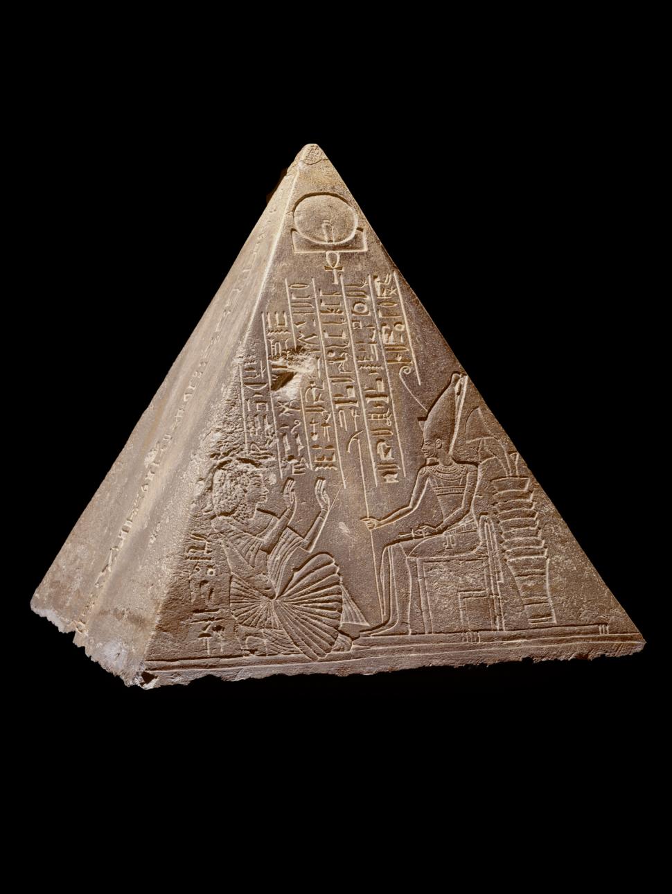 Sandy colouted pyramid artefact with markings, drawings and inscriptions