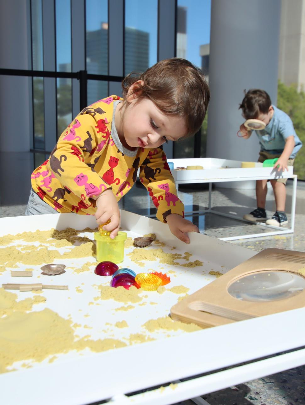 child playing with sand