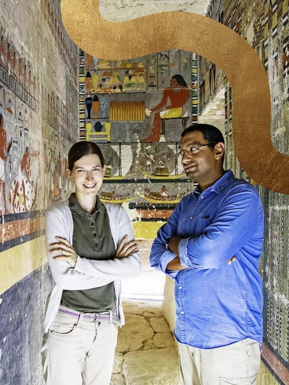 Dr. Mohamed Megahed and Dr. Hana Vymazalová stand side by side with their arms folded, facing the camera. They are situated inside an Egyptian tomb adorned with illustrations on the walls.