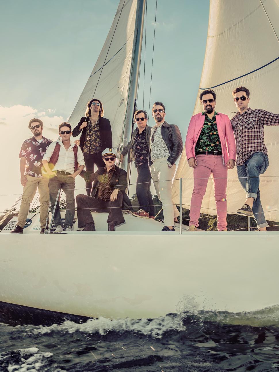 Image of Perth yacht rock band Some Like It Yacht relaxing on board a real yacht.