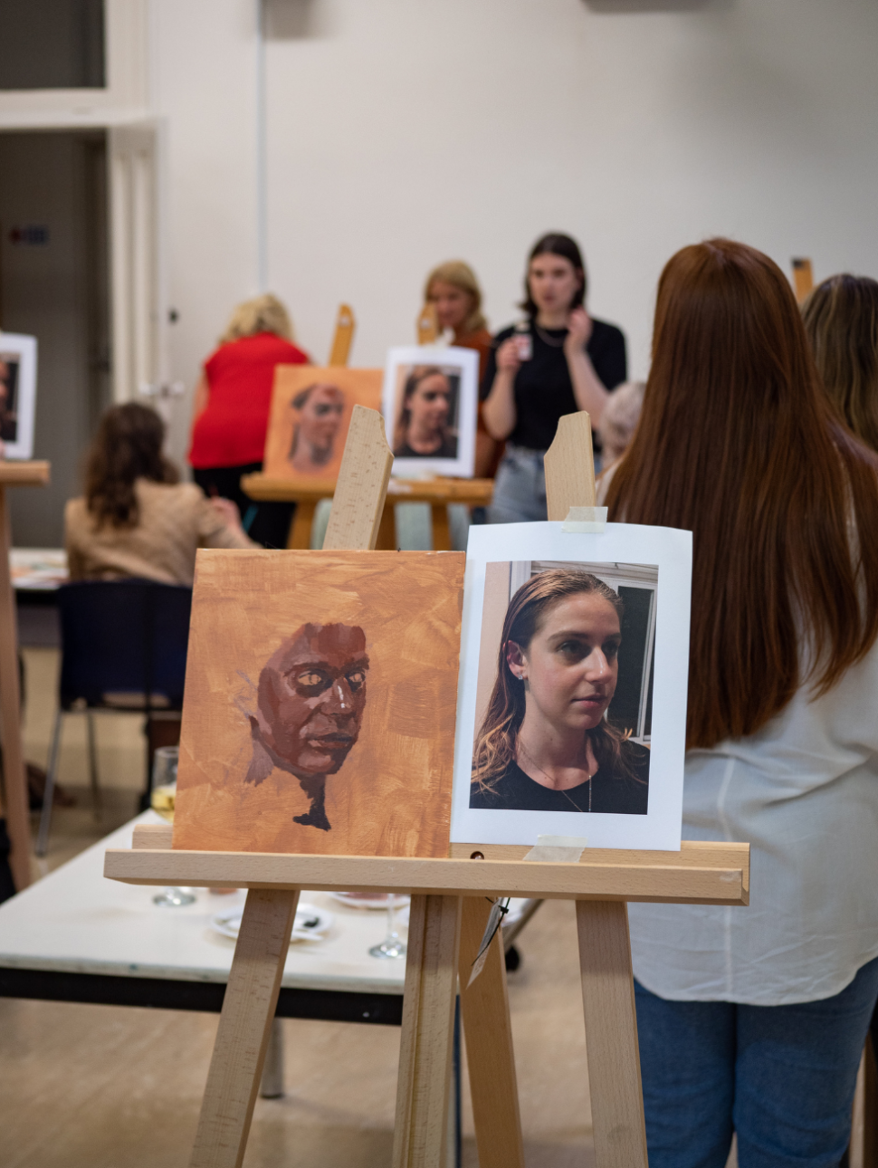 People painting in a workshop