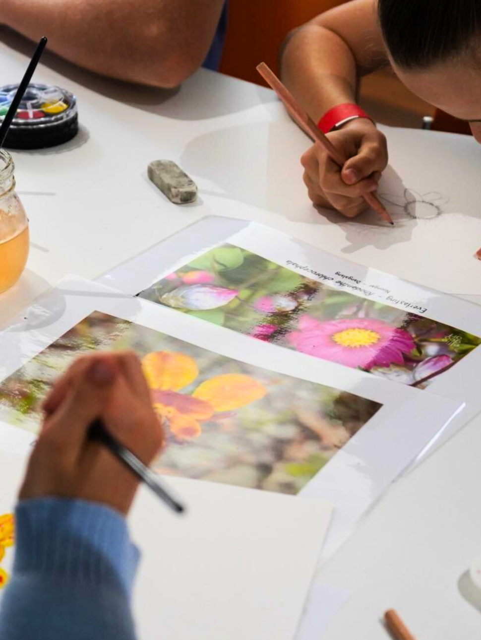 Kids drawing colourful flowers