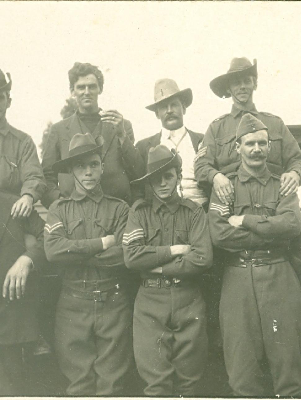 a group of young service men in the trenches of war
