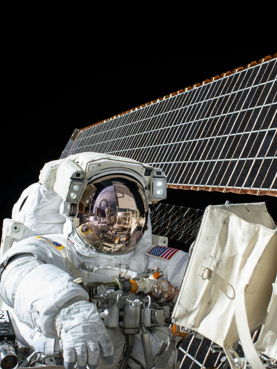 This is an image of a NASA  astronaut on a space walk outside the International Space Station 