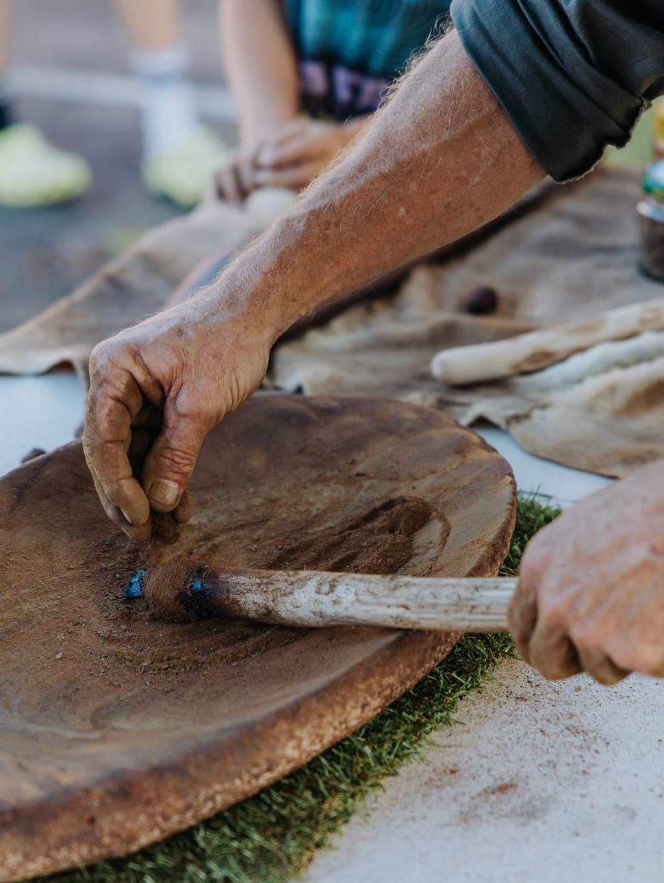 close up of a wooden object being crafted by someone