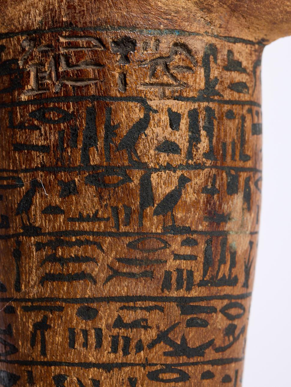 a close up of hieroglyphic symbols on a statue 