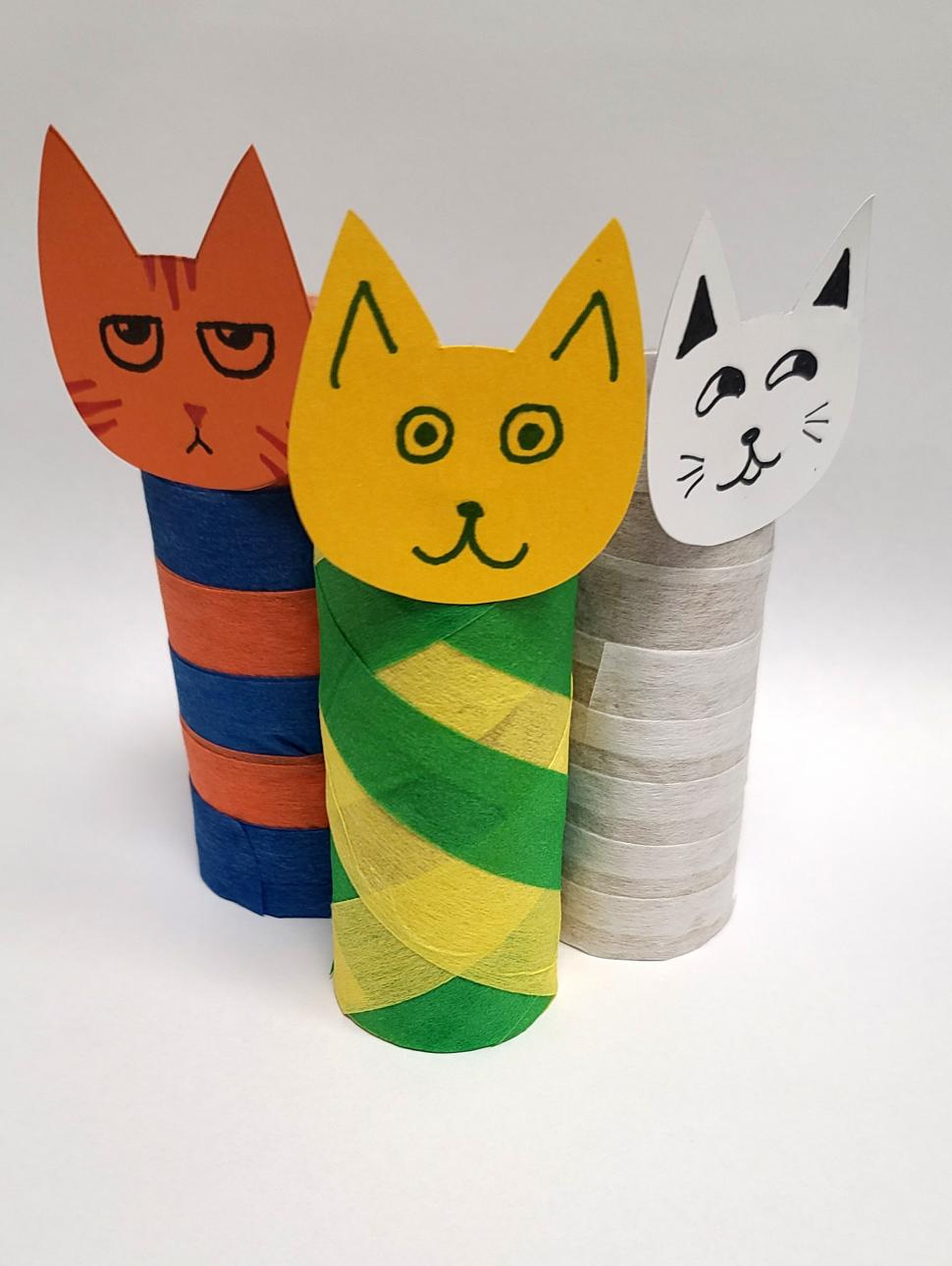 three multi coloured craft cat mummy made out of paper and cardboard