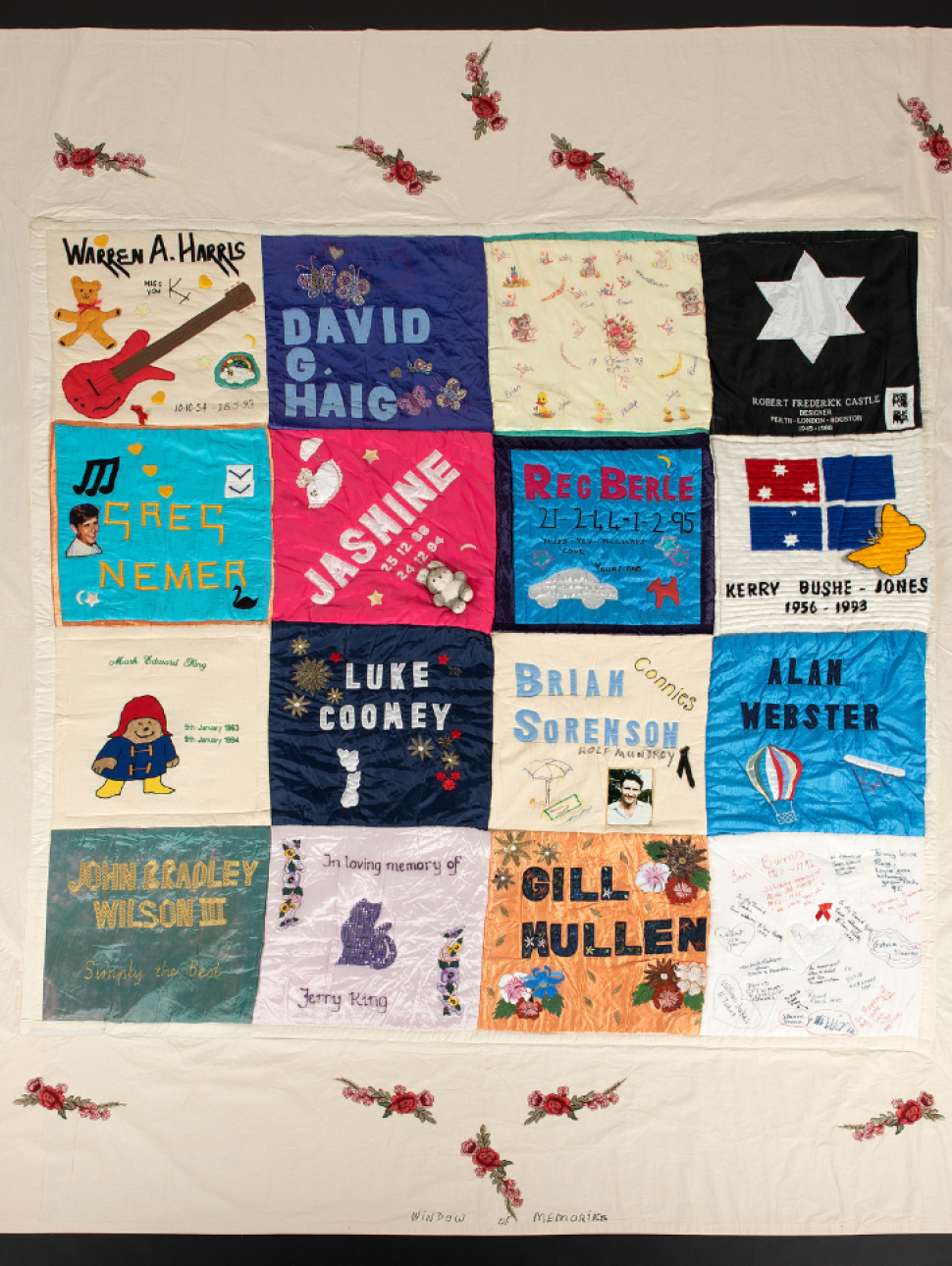 Patch of WA Aids Quilt with multiple names: Warren A Harris, David G Haig, Robert Frederick Castle, Greg Nemer, Jasmine, Reg Berle, Kerry Bushe-Jones, Luke Coomey, Brian Sorenson (Connies), Alan Webster, John Bradley Wilson III, In loving memory of Jerry King, Gill Mullen.