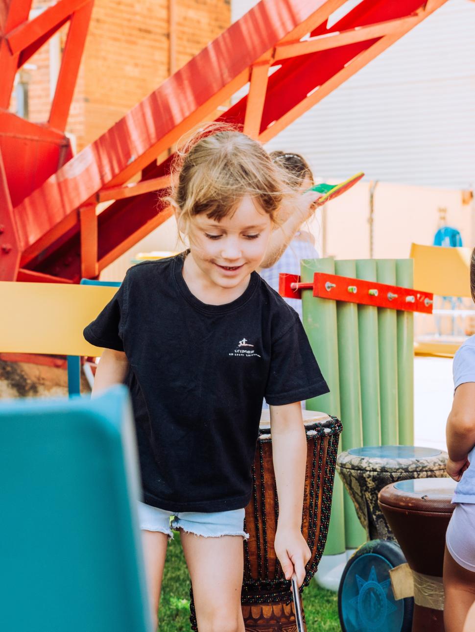children playing with wordly musical drumming instruments