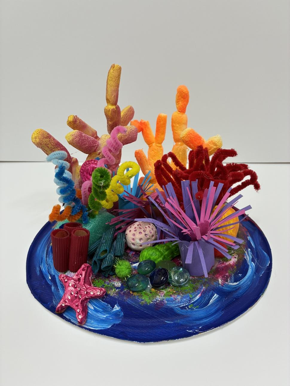 a colourful scuplture of coral using craft materials