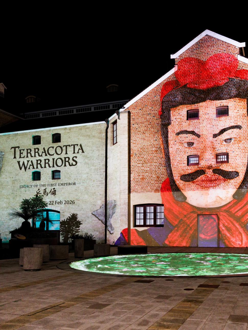 Projections of a warrior illustration on a builiding