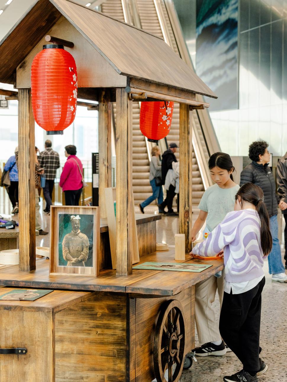 Children playing with puzzles at Chinese cart