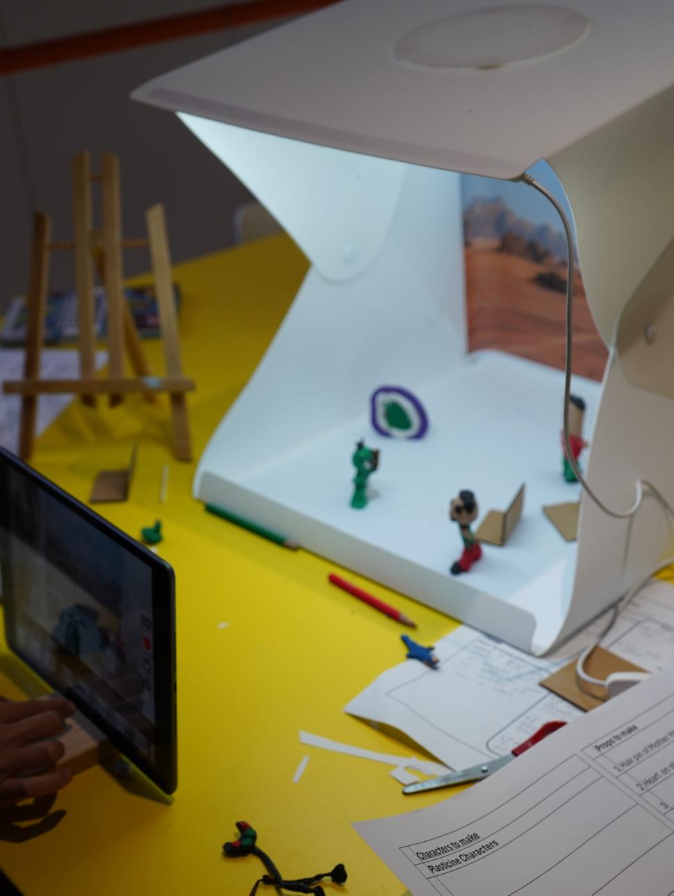 Clay characters with backdrop and iPad for filming