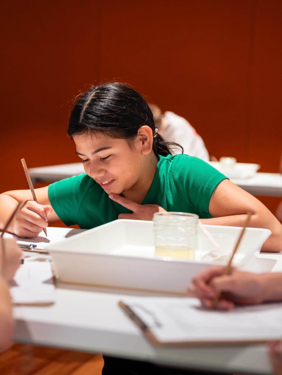 Young girl working at desk 
