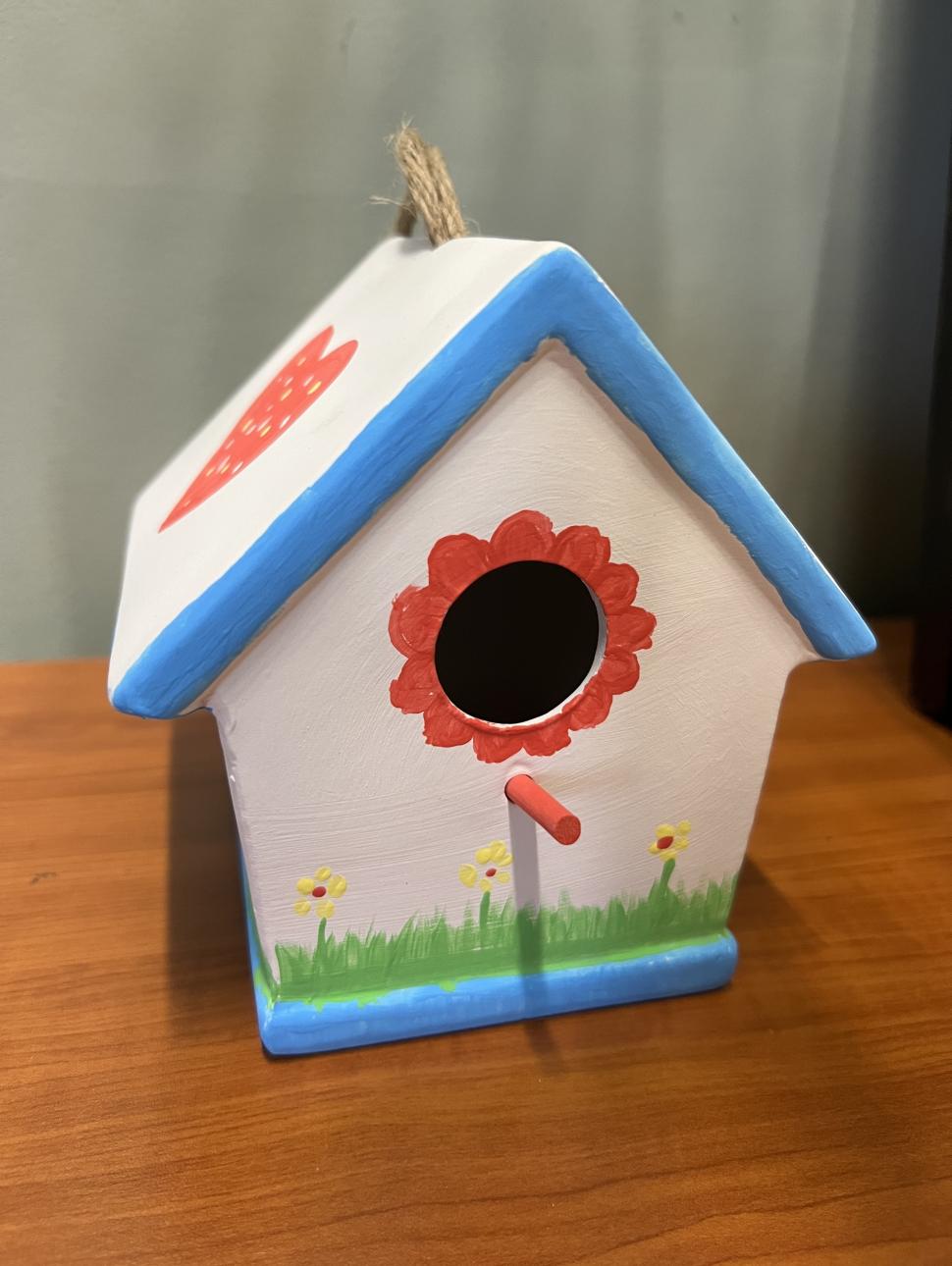 a decorated colourful bird feeder