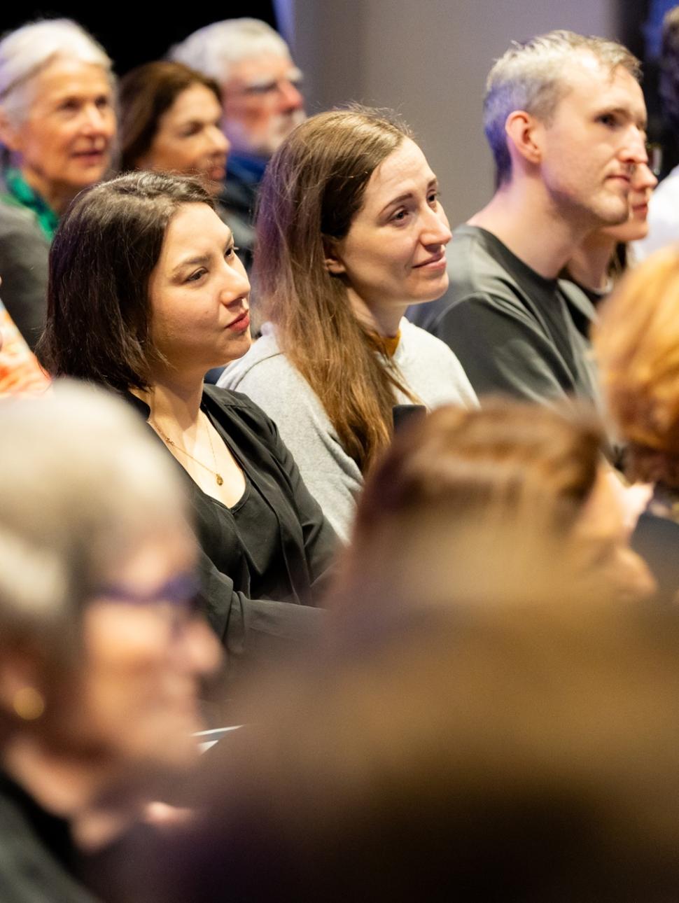 a group of people listening