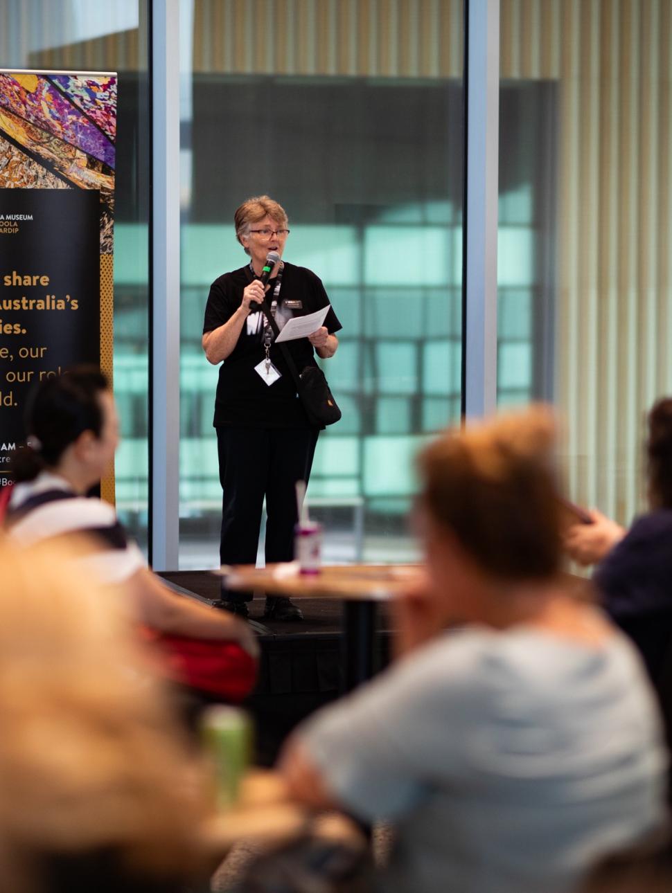 Museum staff presenting to audience of teachrs