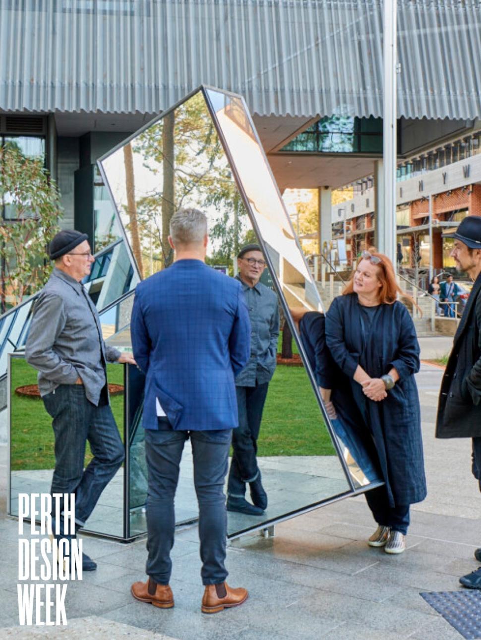 4 People standing around a Sculpture with the Perth Design Week Logo in the bottom Left corner