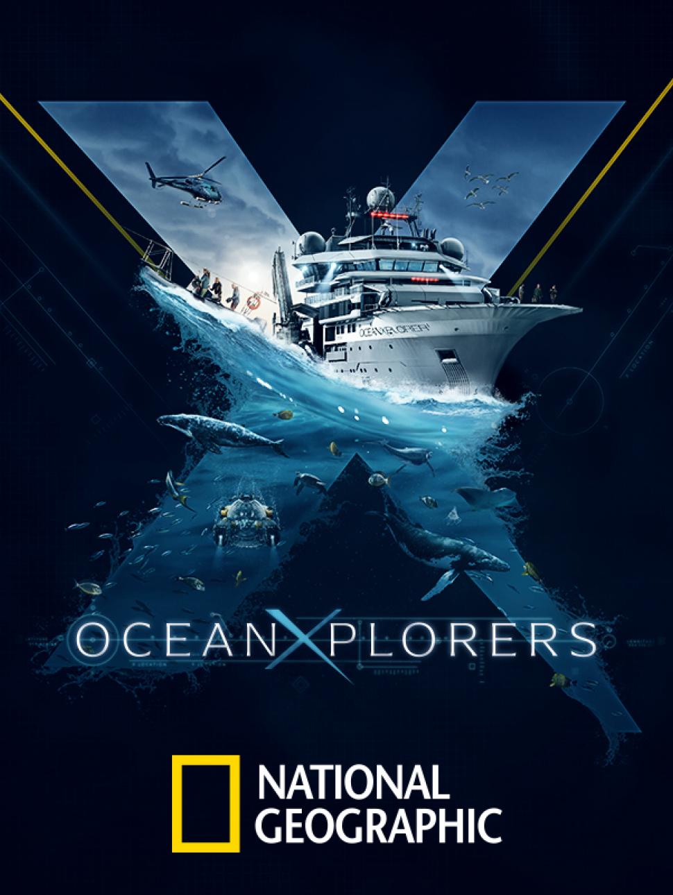 A large white research vessel, the OceanXplorer, sails across calm blue ocean waters with a helipad at the bow and multiple decks of scientific equipment, set against a clear sky and distant coastline.
