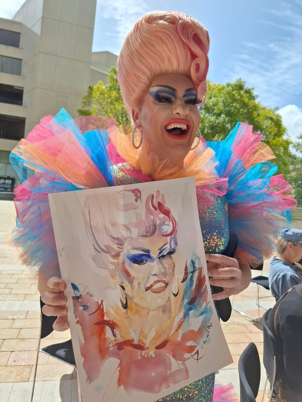 Drag artist holding portrait