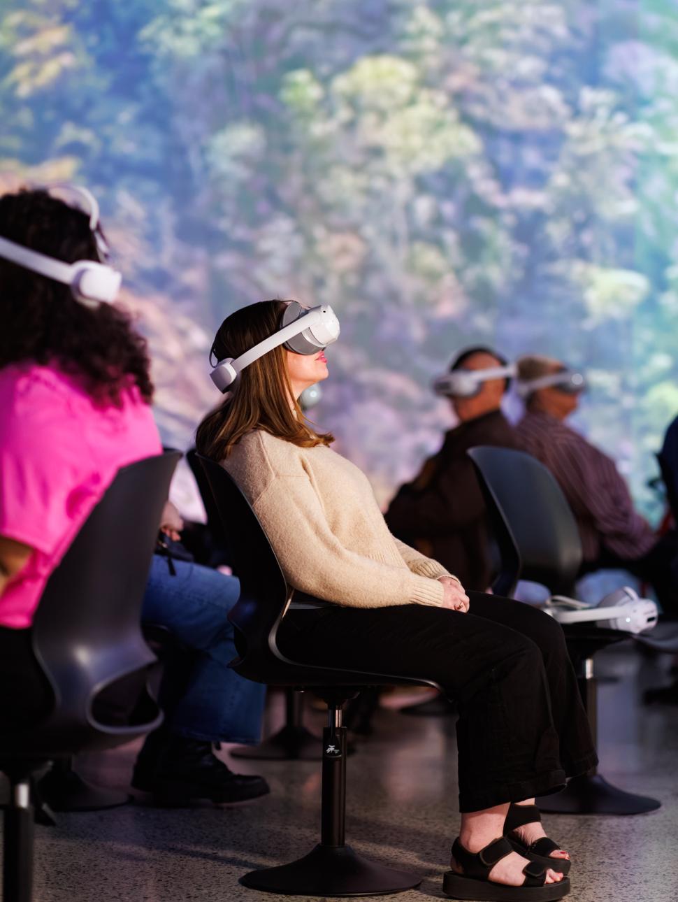 a person wears a virtual reality headset and places it on their head