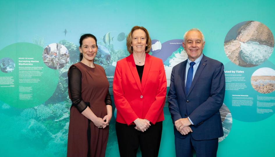 Coralie Bishop, Meg O'Neil and Alec Coles in front of the a marine wall
