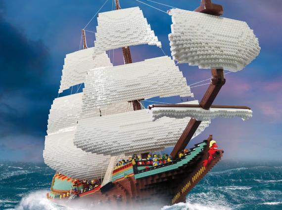 A poster featuring a LEGO ship sailing on the ocean