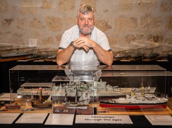 Model maker Gerry Westenberg and one of his model ships on display at WA Shipwrecks Museum, 2020