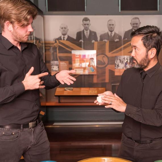 Two AUSLAN interpreters in the Reflections gallery