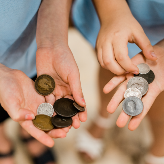 children holding coins