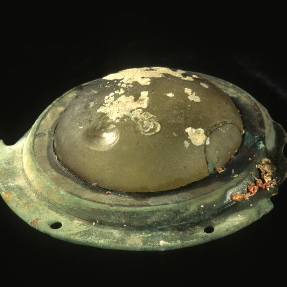 Round metal base with a glass dome on top; the glass is slightly damaged.