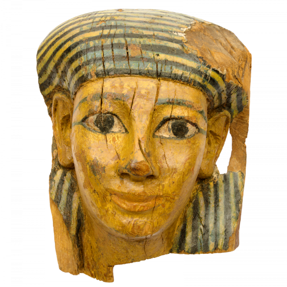 The image shows a colourfully decorated wooden Egyptian coffin head.